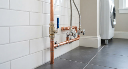 Post-repair finished residential water pipe valve installation, dry floor surface, spotless high standard maintenance completion, bright clean lighting